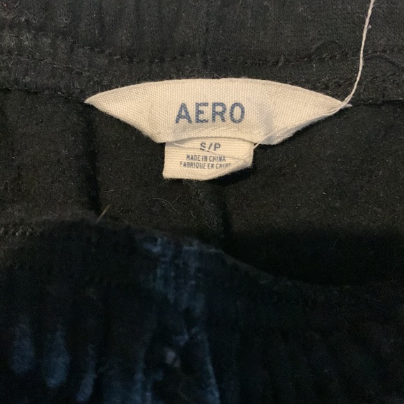 Black aero joggers, w/ white/grey lettering down one leg - Picture 3 of 3